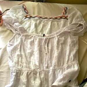 Two white shirts, both stretchy